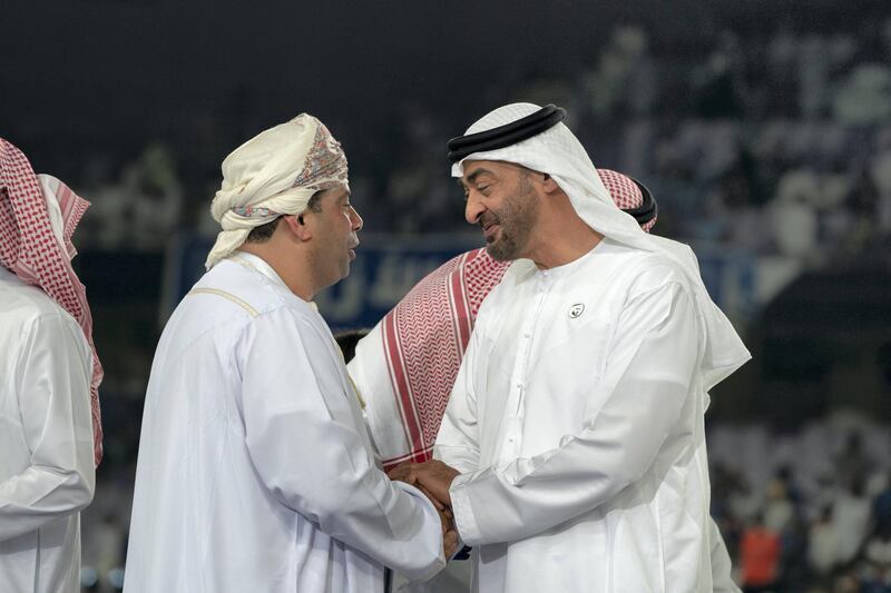 AL AIN, UNITED ARAB EMIRATES - April 18, 2019: HH Sheikh Mohamed bin Zayed Al Nahyan Crown Prince of Abu Dhabi Deputy Supreme Commander of the UAE Armed Forces (R) greets a guest during the 2018–19 Zayed Champions Cup final football match between Al Hilal and Etoile du Sahel, at Hazza bin Zayed Stadium.

( Mohamed Al Hammadi / Ministry of Presidential Affairs )
---