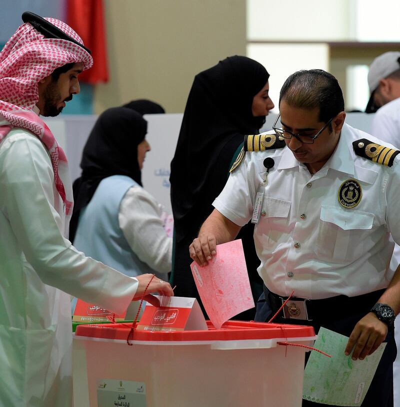 A Bahraini voter casts his ballot. AFP
