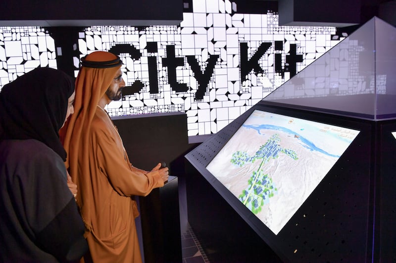 Sheikh Mohammed bin Rashid tries out some of the museum's technological features. Wam