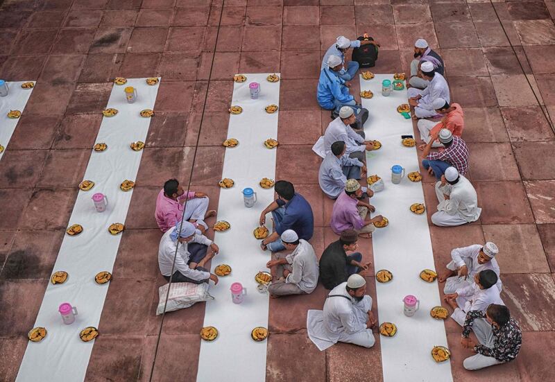 In this picture  Indian Muslims wait to break their fast during the Islamic holy month of Ramadan at Jama Masjid in New Delhi.   AFP