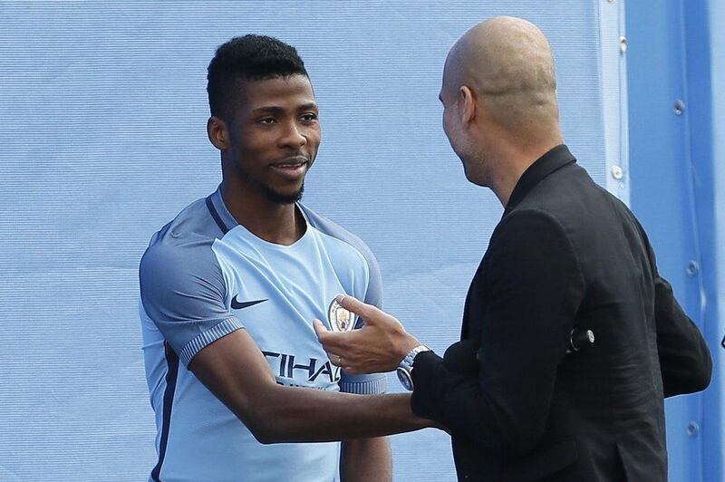 Manchester City manager Pep Guardiola with Kelechi Iheanacho at the City Football Academy. Craigh Brough / Action Images / Reuters