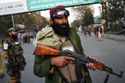 Taliban fighters stand guard in Kabul. AFP