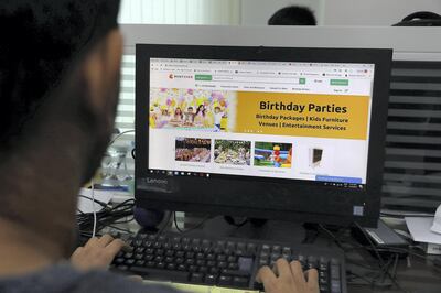 DUBAI , UNITED ARAB EMIRATES , April 15 – 2019 :- One of the employee doing online booking at the RentSher Middle East office, a Dubai based online platform for rentals of products and services at the Tiffany Tower in JLT in Dubai. ( Pawan Singh / The National ) For Business. Story by Nada El Sawy