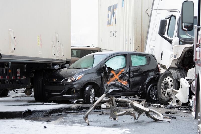 A small car is crushed between tractor trailers after the Pennsylvania crash. Republican-Herald / AP