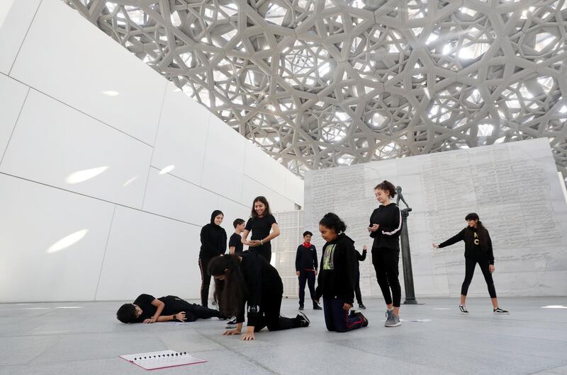 Abu Dhabi, United Arab Emirates - December 04, 2019: Maplewood School, Grade 7. The Young Guides programme sees school children from across the UAE take part in a 6-week long programme to learn about a select group of objects from the museumÕs permanent collection and receive special training from Louvre AbuDhabiÕs Education team, who teach them how to present and educate a museum-going audience about artistic objects. Wednesday, December 4th, 2019. Louvre, Abu Dhabi. Chris Whiteoak / The National