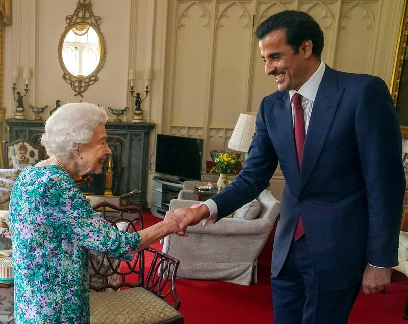 Britain's Queen Elizabeth II welcomes Qatari Emir Sheikh Tamim at Windsor Castle on Tuesday. AFP