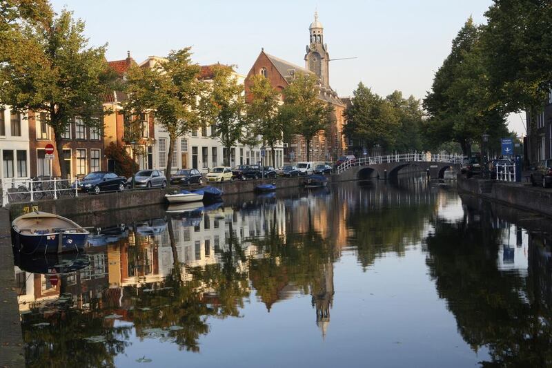 Leiden University’s canalside Academy Building looms in the background in Leiden, Netherlands. The university has offered studies in Arabic for the past 400 years. Tim Draper

