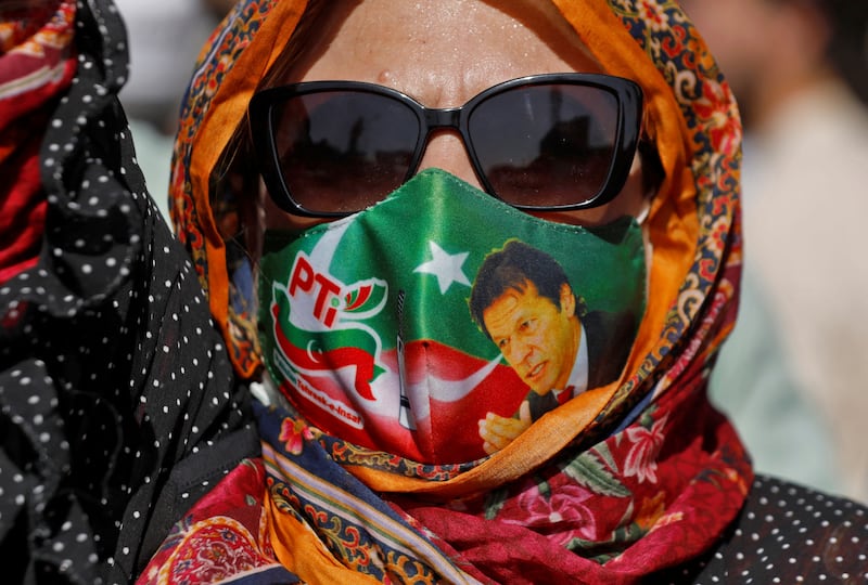 A supporter of Mr Khan participates in a protest against his arrest in Peshawar. Reuters