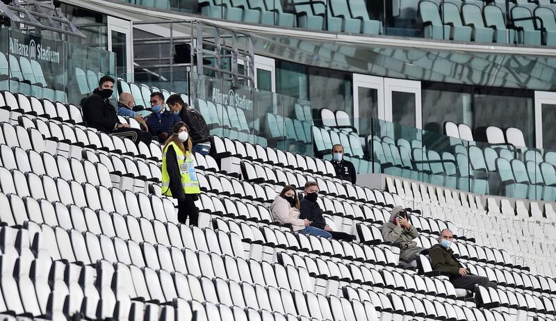 Supporters inside the Juventus Stadium wait to discover if the match against Napoli will go ahead. EPA