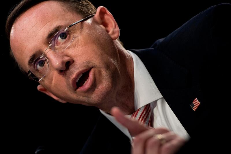 (FILES) In this file photo taken on June 07, 2017, Deputy Attorney General Rod Rosenstein testifies during a Senate Select Intelligence Committee hearing on the Foreign Intelligence Surveillance Act on Capitol Hill in Washington, DC.  US Deputy Attorney General Rod Rosenstein denied Friday, September 21, 2018 a report that he had suggested looking for ways to remove Donald Trump on grounds of mental fitness, just months after the president took office.
Rosenstein said that The New York Times report -- which alleged that he also proposed around early May 2017 that cabinet members record Trump for evidence of his mental fitness -- as "inaccurate and factually incorrect."
Rosenstein and the Justice Department did not deny the remarks themselves, but suggested they had been made jokingly. They were apparently made in the presence of other senior Justice Department officials only weeks after Rosenstein took office on April 29, 2017.  / AFP / Brendan Smialowski
