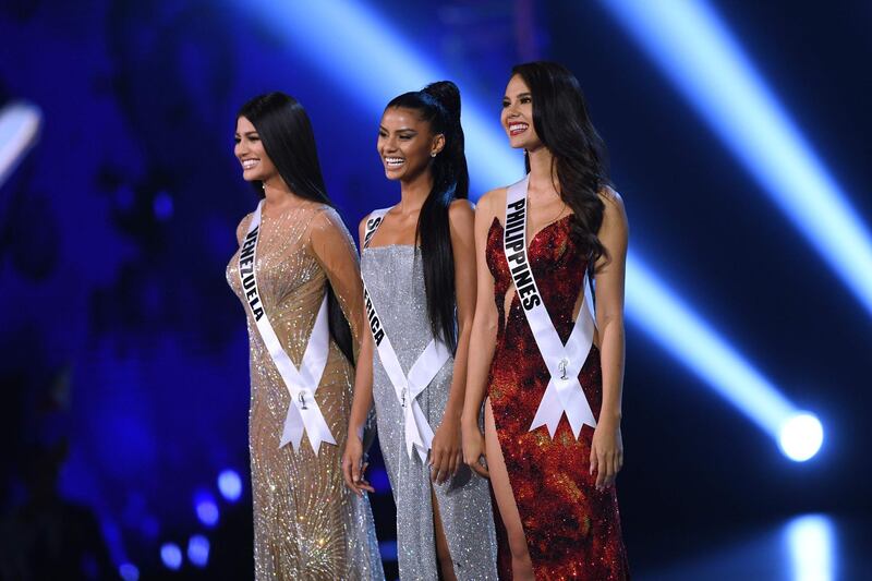 Sthefany Gutierrez of Venezuela, Tamaryn Green of South Africa and Catriona Gray of the Philippines stand on stage after being selected as top three finalists. AFP