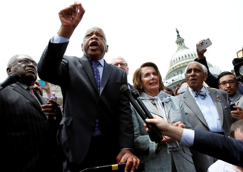 US Representative John Lewis talks to supporters along with House Democrats after their sit-in over gun-control law on Capitol Hill in Washington, DC, on June 23, 2016. Reuters