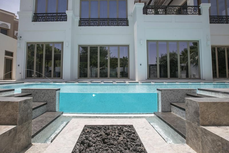 The pool deck also has a private Jacuzzi, while the villa has three balconies with views. Mona Al Marzooqi / The National