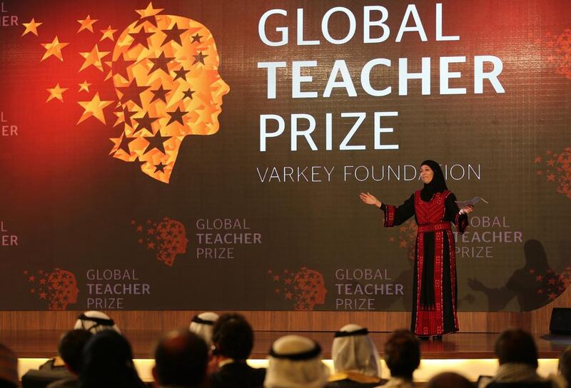 Palestinian primary school teacher Hanan Al Hroub speaks after she won the second annual Global Teacher Prize, in Dubai. Kamran Jebreili / AP Photo