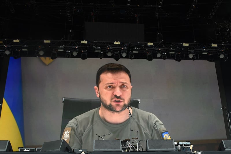 Ukraine's President Volodymyr Zelenskyy addresses festivalgoers via a video link. AFP