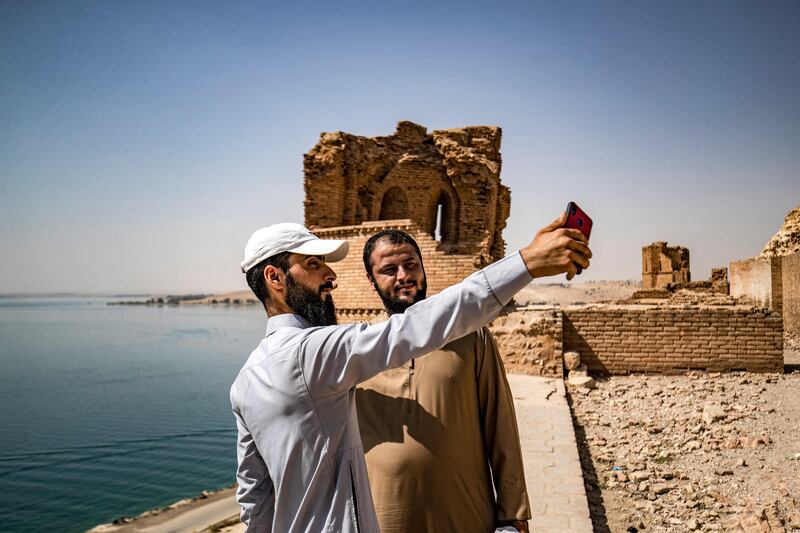 Men pose for a 'selfie' at Jaabar Citadel (Qalaat Jaabar) in Syria's Lake Assad reservoir in Raqa province. All photos by AFP