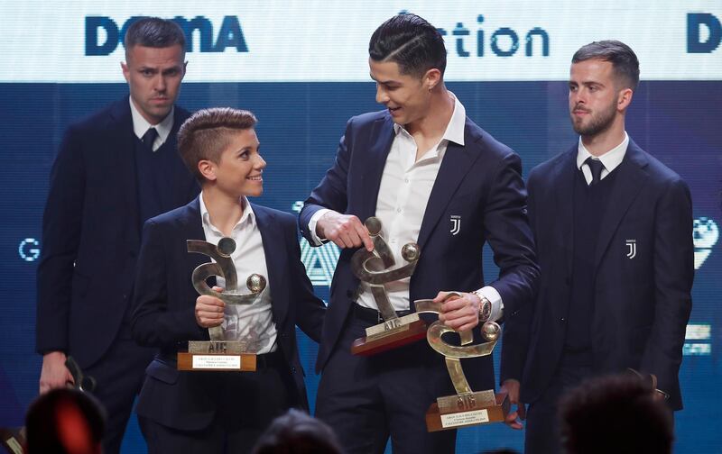 Cristiano Ronaldo, right, and Best Women's Player Manuela Giugliano on stage at the Gran Gala del Calcio 2019 ceremony. 
AP Photo