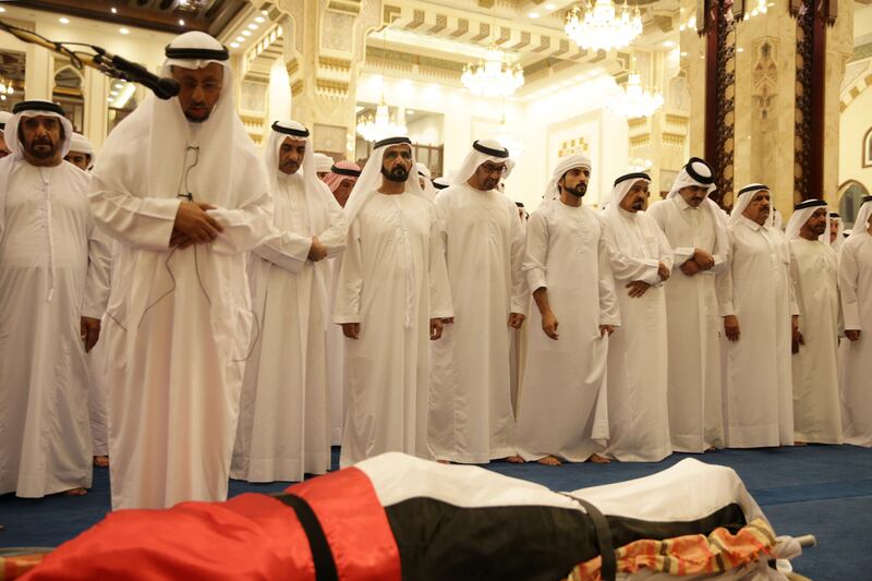 Sheikh Mohammed bin Rashid, Vice President and Ruler of Dubai; Sheikh Mohamed bin Zayed, Crown Prince of Abu Dhabi and Deputy Supreme Commander of the Armed Forces; Sheikh Hamdan bin Mohammed, Crown Prince of Dubai,;and Rulers of the Emirates pray over the body of Sheikh Rashid bin Mohammed at Zabeel Mosque in Dubai. AFP