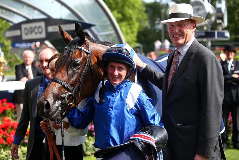 Jockey Paul Hanagan, centre, and trainer John Gosden, left, have been elated after Taghrooda won at the Ascot last month. Charlie Crowhurst / Getty Images