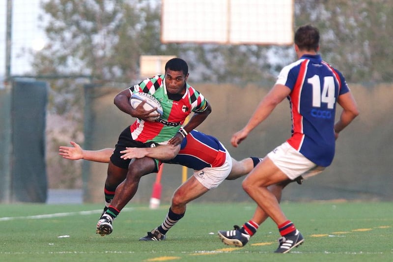 Jebel Ali Dragons, in blue, and Abu Dhabi Harlequins, pictured during a match at the Jebel Ali Centre of Excellence in Dubai on February 21, 2014, meet in their fifth final in 18 months on Friday. Jaime Puebla / The National