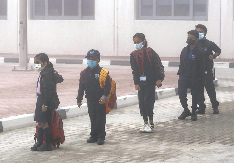 Abu Dhabi, United Arab Emirates, February 14, 2021. Pupils return to Abu Dhabi's private schools. GEMS United Indian School – Abu Dhabi.  A few students arrive in spite of the foggy conditions.
Victor Besa/The National
Section: NA
Reporter:  Anam Rizvi