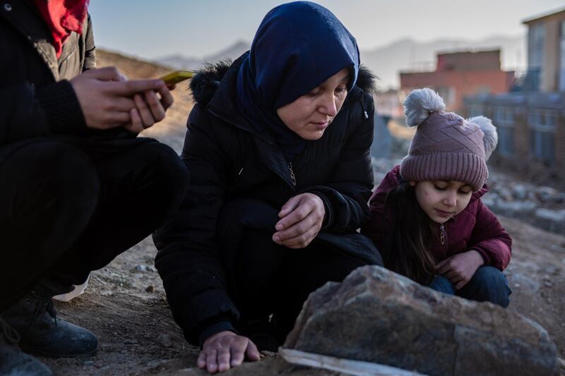 On the outskirts of Kabul, Wahida Shirzad, 38, grieves by the grave of her son Mohammad Rahid Amin, who was killed on 2 November 2020 in an attack on Kabul University. The 22-year-old political science student leaves behind two sisters, a brother, and both of his parents. 