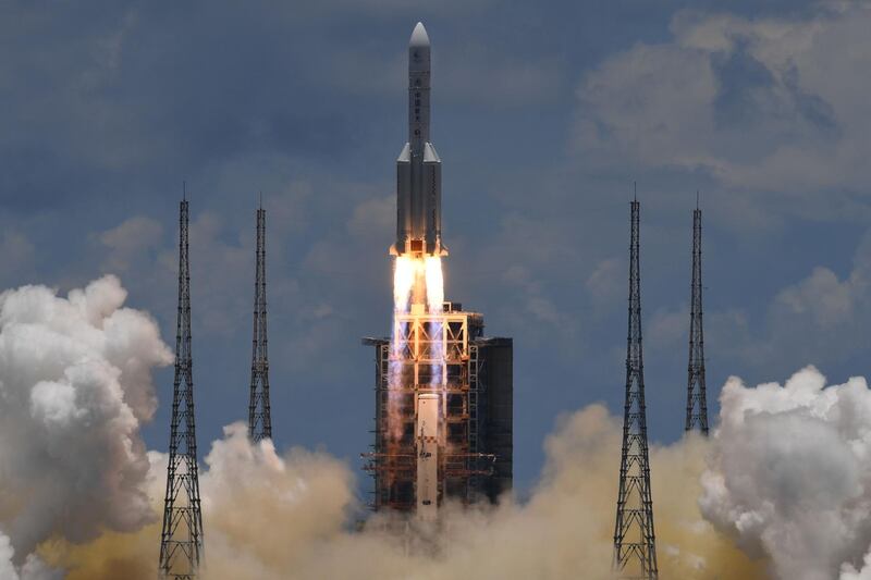 A Long March-5 rocket, carrying an orbiter, lander and rover as part of the Tianwen-1 mission to Mars, lifts off from the Wenchang Space Launch Centre in southern China's Hainan Province.  AFP