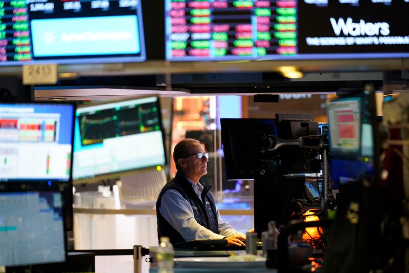 Traders work at the New York Stock Exchange. All the optimism has sent the S&P 500 to the brink of its sixth advance in seven months. AP