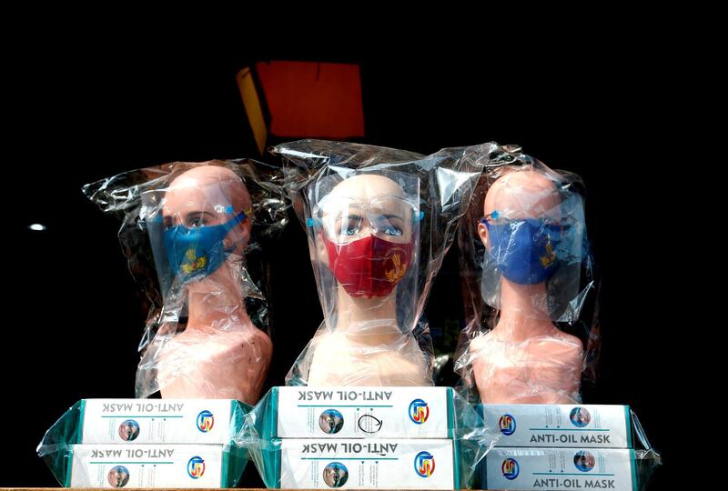 Mannequins wearing protective face masks and face shields are displayed at a market in Jakarta, Indonesia. Reuters