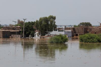 A view of a mosque and flooded homes on the outskirts of Bhan Syedabad in Pakistan. Reuters