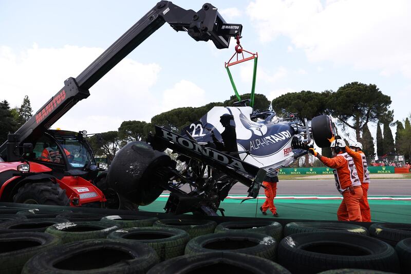 The car of AlphaTauri's Yuki Tsunoda is removed after crashing on track during qualifying. Getty