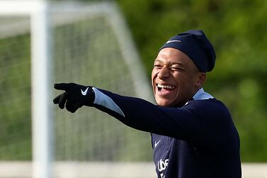 France's forward Kylian Mbappe reacts during a training session, as part of the team's preparation for upcoming UEFA Euro 2024 Football Championship, in Clairefontaine-en-Yvelines on May 30, 2024.  The UEFA Euro 2024 championship will take place from June 14 to July 14, 2024 in Germany.  (Photo by FRANCK FIFE  /  AFP)