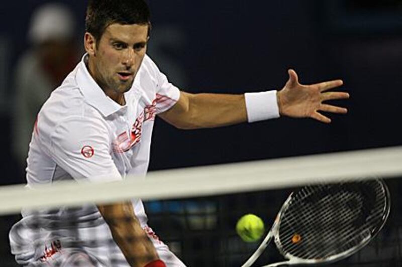 Novak Djokovic returns the ball to Guillermo Garcia-Lopez last night in Dubai.