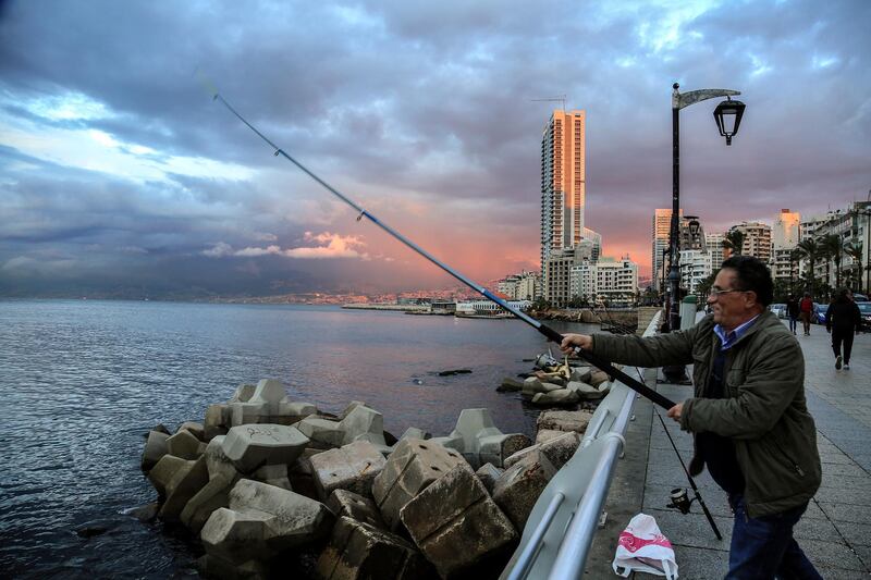 A man fishes over the Mediterranean Sea in Beirut, Lebanon. EPA