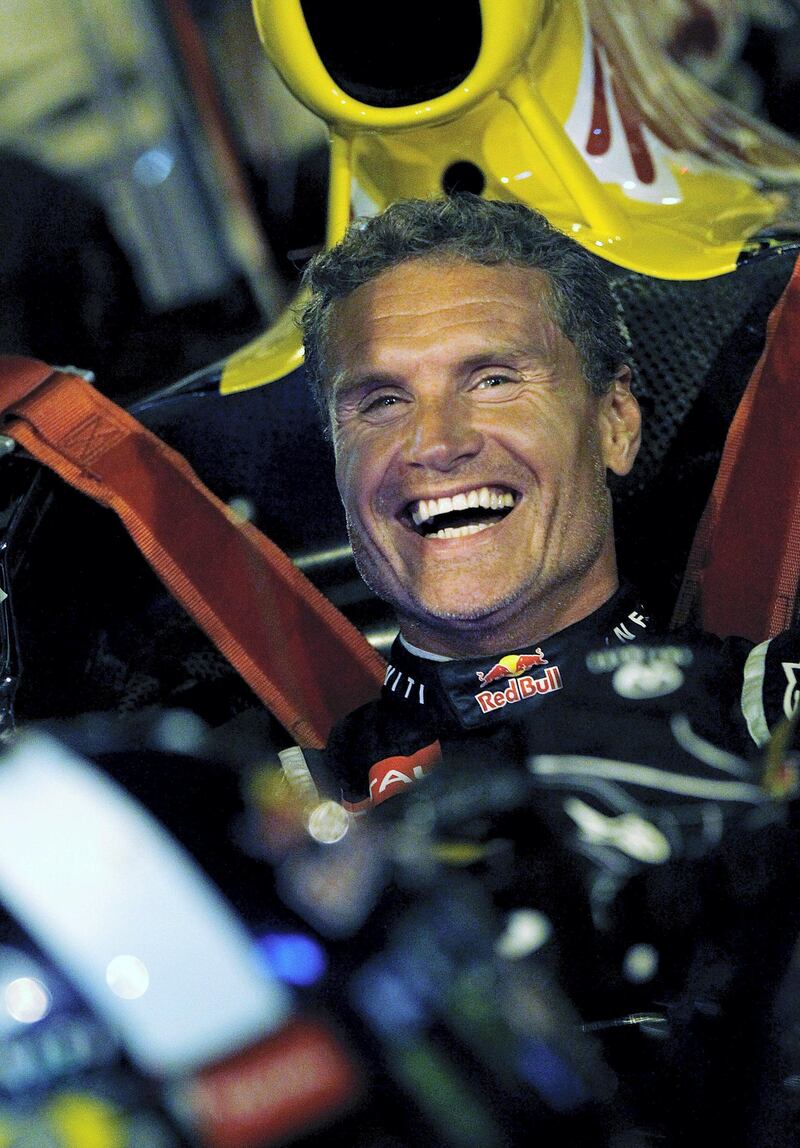 WEEHAWKEN, NJ - AUGUST 15:  Former Red Bull Racing Formula 1 driver David Coulthard prepares to drive the Red Bull running show car through the Lincoln Tunnel between Manhattan and New Jersey for a video shoot on August 15, 2012 in Weehawken, New Jersey.  (Photo by Jeff Zelevansky/Getty Images for Red Bull)