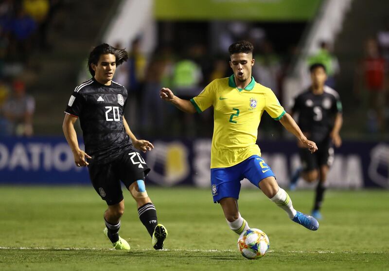 BRASILIA, BRAZIL - NOVEMBER 17: Yan Couto of Brazil looks to break past Bruce El-Mesmari of Mexico during the Final of the FIFA U-17 World Cup Brazil 2019 between Mexico and Brazil at the Estadio Bezerrão on November 17, 2019 in Brasilia, Brazil. (Photo by Buda Mendes - FIFA/FIFA via Getty Images)