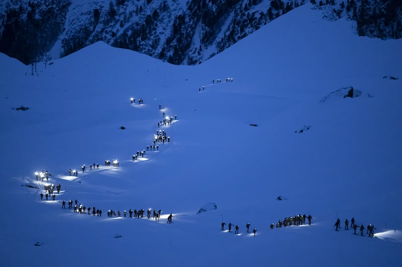Competitors in the 24th Glacier Patrol race in the Swiss Alps between Arolla and Verbier, Switzerland, on April 21 climb towards the Tsena Refien pass. EPA
