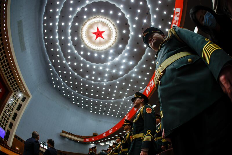 Military band members stand at attention during the opening ceremony. EPA