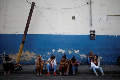 Relatives of inmates at the General Command of the Carabobo Police wait outside the prison, where a fire occurred in the cells area, according to local media, in Valencia, Venezuela March 28, 2018. REUTERS/Carlos Garcia Rawlins