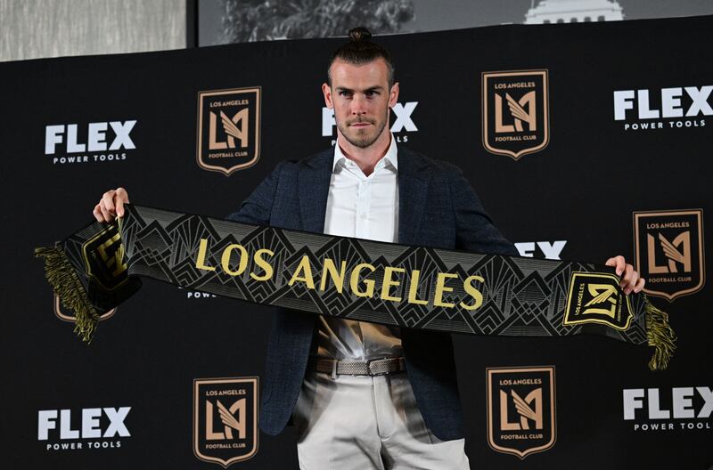 Gareth Bale holds up a Los Angeles Football Club scarf. AFP