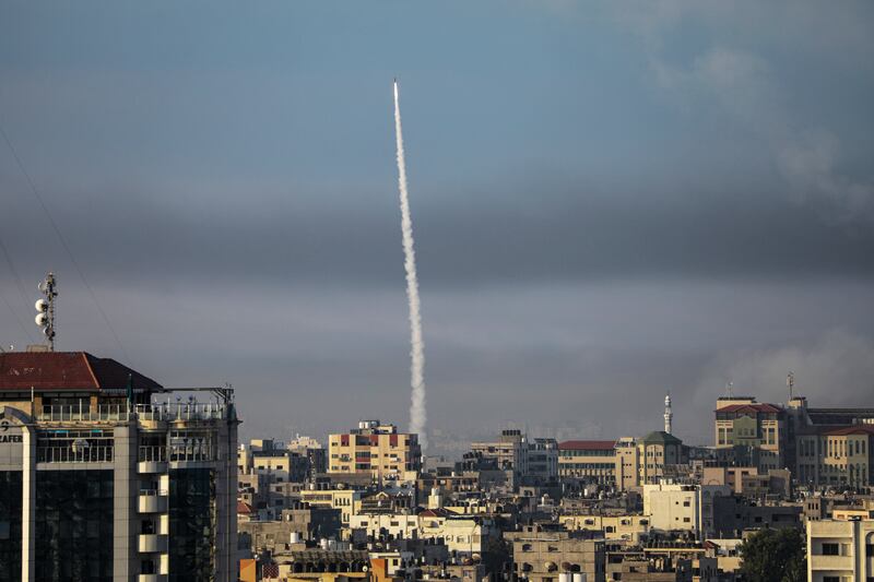 A rocket is launched by the Ezz Al Din Al Qassam militia from the coastal Gaza strip towards Israel. EPA