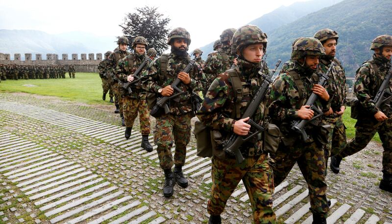 Switzerland says its military will continue to stay out of any foreign conflict. Reuters