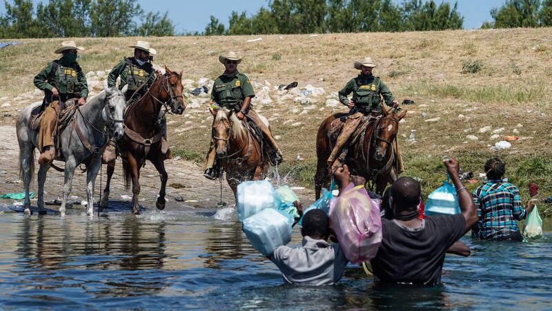 US law enforcement officers attempt to close off crossing points along the Rio Grande. AFP