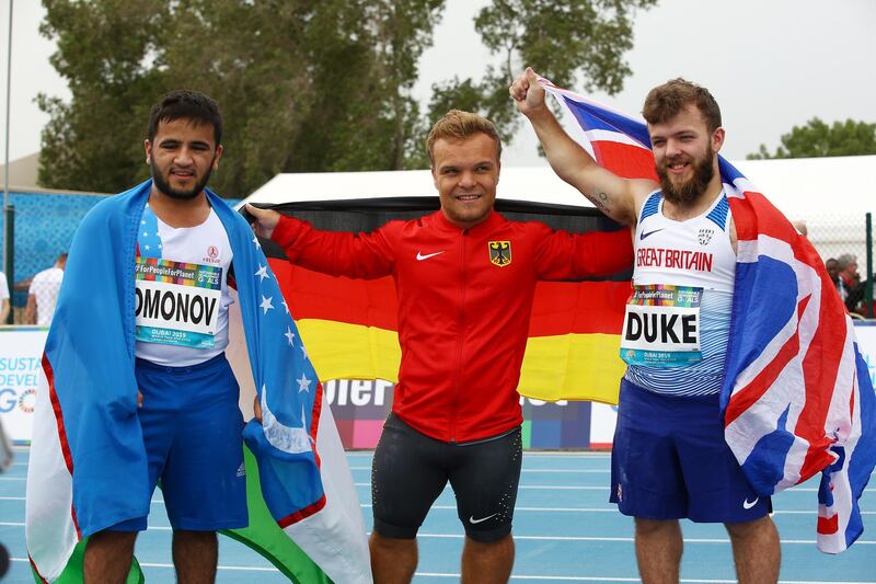 Niko Kappel of Germany, left, Bobirjon Omonov of Uzbekistan, centre, and Kyron Duke of Great Britain succeeded in the men's shot put F41 final at the World Para Athletics Championships in Dubai. EPA