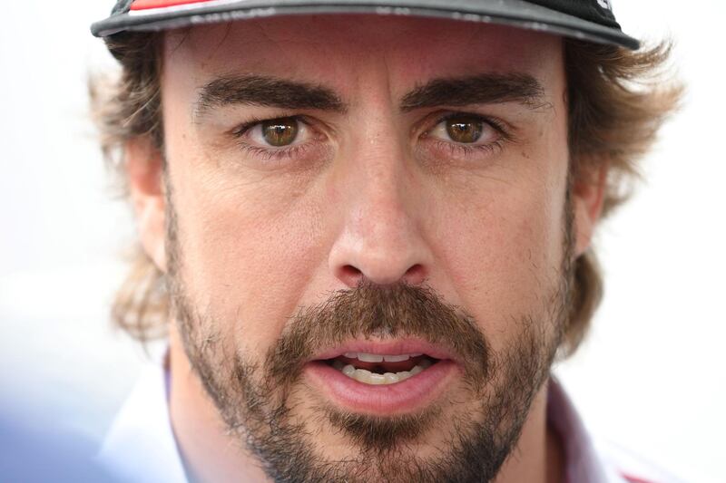 (FILES) In this file photo taken on June 15, 2018 Toyota TS050 Hybrid LMP1 Spainish driver Fernando Alonso speaks during a press conference on the eve of the 86th edition of the 24 Hour race at the Le Mans circuit. - Fernando Alonso will retire from Formula 1 at the end of the season McLaren announced on August 14, 2018. (Photo by Jean-Francois MONIER / AFP)