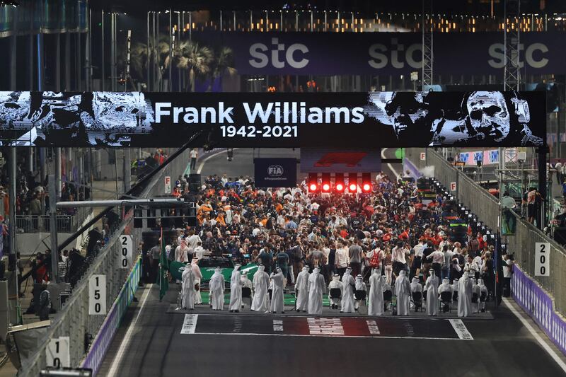 Drivers and team members pay tribute to the late founder and former team principal of Williams Racing, Frank Williams who died a week before the race. AFP