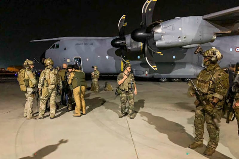 French soldiers at the airport in Kabul as they arrive to help French citizens and their Afghan colleagues to flee after the Taliban takeover.