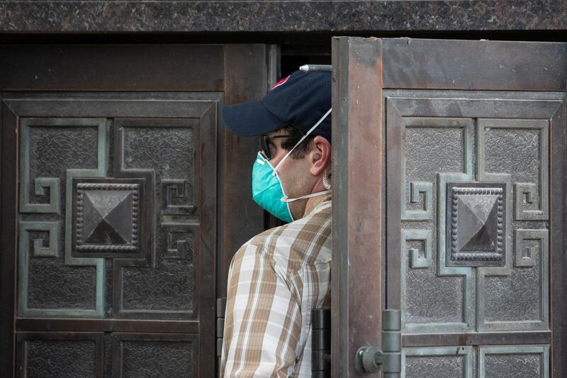 A plainclothes US security official enters the back door of China’s Consulate after Chinese employees left the building, in Houston, Texas, US. Reuters