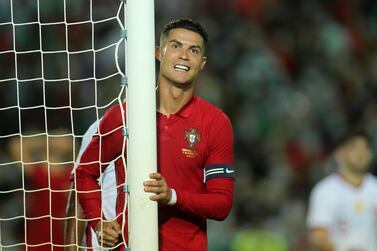 Portugal's Cristiano Ronaldo reacts after failing to score during the international friendly soccer match between Portugal and Qatar at the Algarve stadium outside Faro, Portugal, Saturday, Oct.  9, 2021.  (AP Photo / Joao Matos)