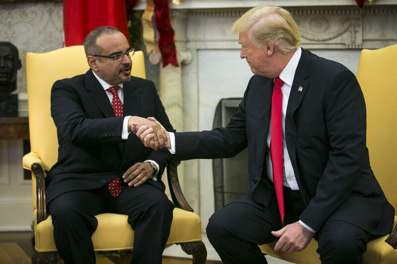 U.S. President Donald Trump, right, shakes hands with Salman bin Hamad Al-Khalifa, Crown Prince of Bahrain, during a meeting in the Oval Office of the White House in Washington, D.C., U.S., on Thursday, Nov. 30, 2017. The White House is discussing whether to replace Secretary of State Rex Tillerson with CIA Director Mike Pompeo, two White House officials said. Photographer: Al Drago/Bloomberg
